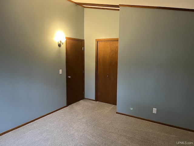 unfurnished room featuring carpet flooring