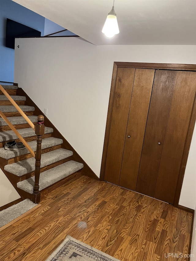 stairs with wood-type flooring