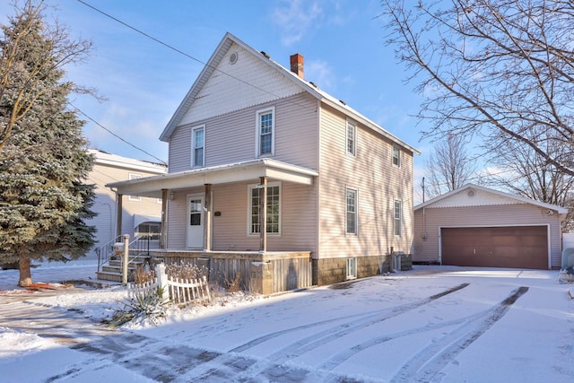 front of property with an outbuilding, covered porch, central AC unit, and a garage