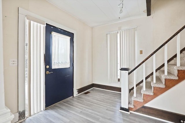 entrance foyer featuring wood-type flooring