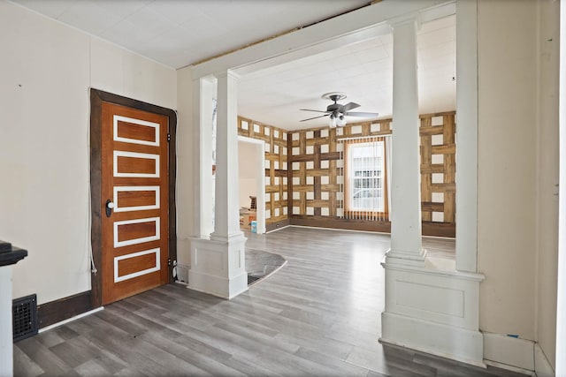 entryway featuring decorative columns, ceiling fan, and hardwood / wood-style floors