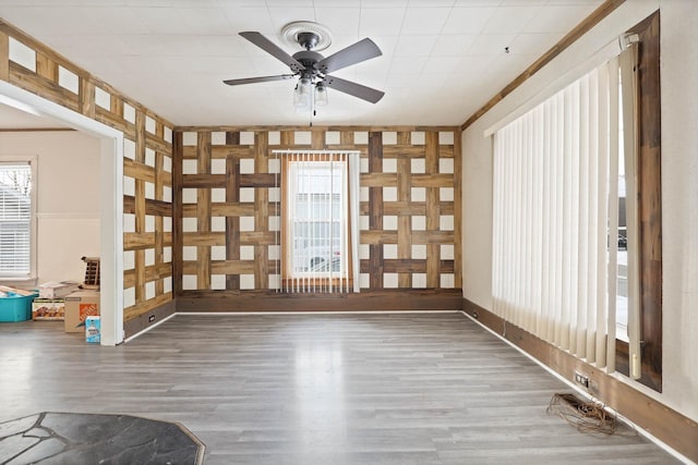 interior space featuring ceiling fan, hardwood / wood-style floors, and plenty of natural light