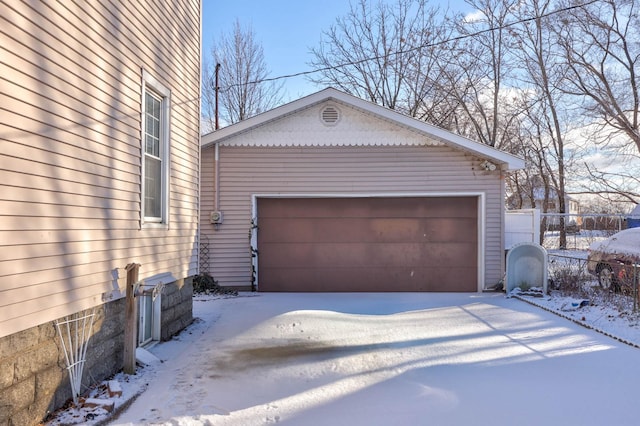 view of snow covered garage