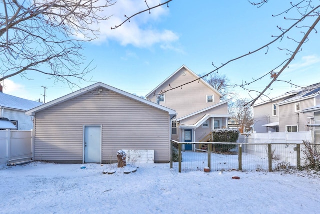 view of snow covered house