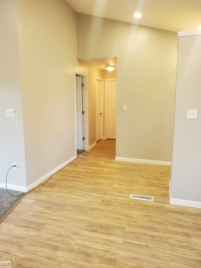 spare room with light hardwood / wood-style floors