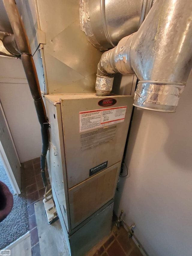 utility room with heating unit