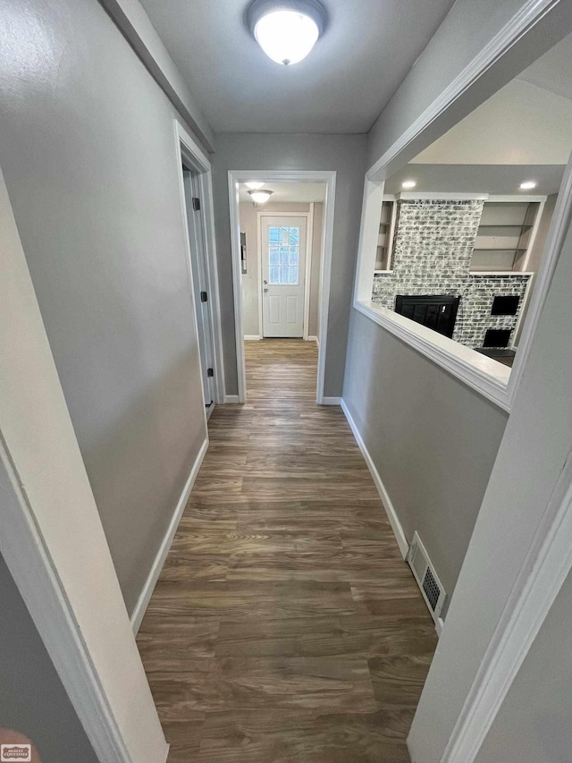 hallway with dark hardwood / wood-style floors