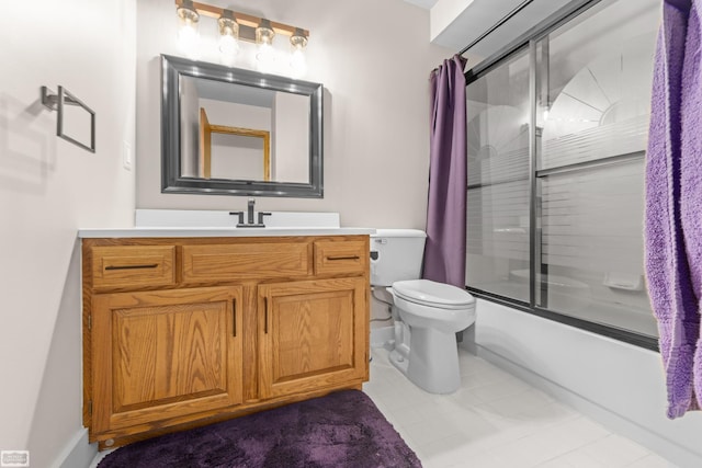 full bathroom featuring tile patterned flooring, vanity, toilet, and bath / shower combo with glass door