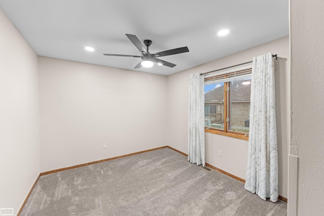 unfurnished room with light carpet and ceiling fan