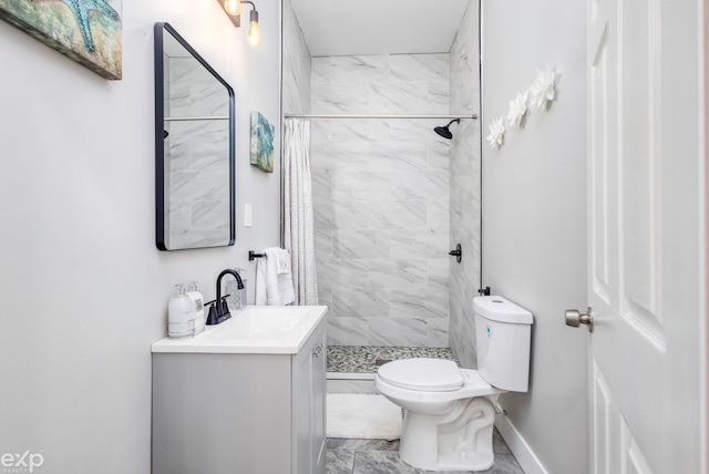 bathroom featuring vanity, toilet, and walk in shower