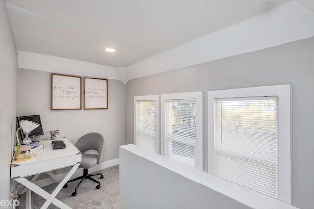 office featuring light colored carpet and vaulted ceiling