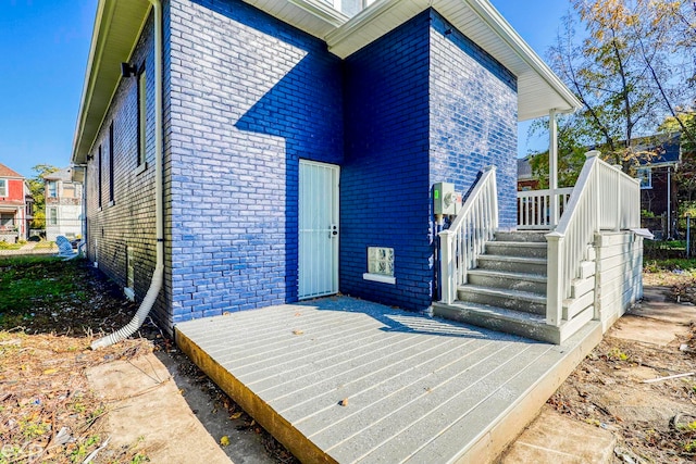 back of house featuring a wooden deck