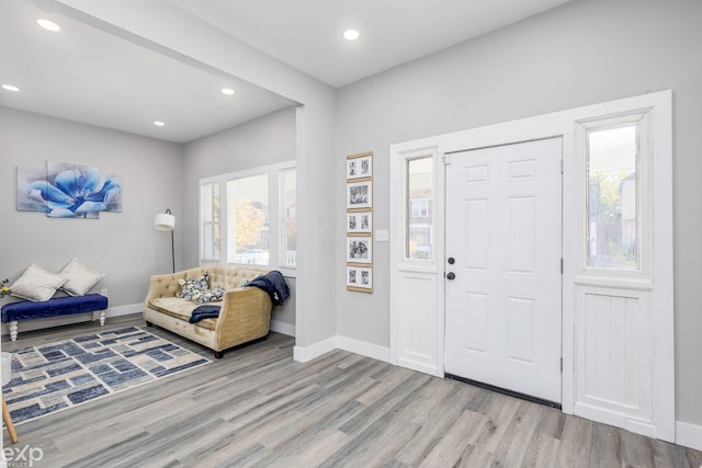 foyer entrance with light hardwood / wood-style floors