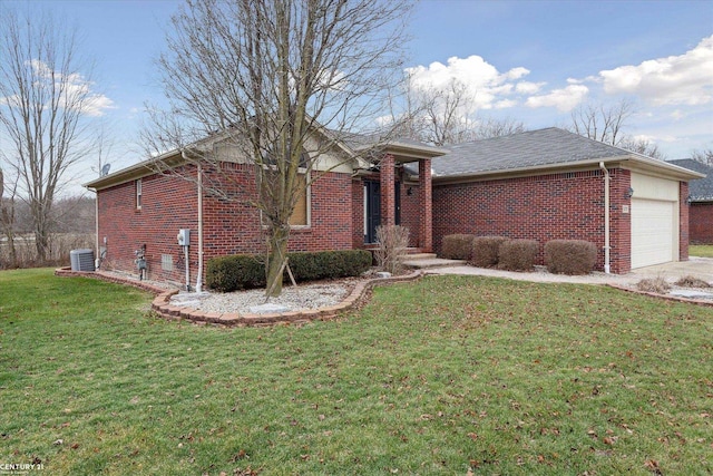 view of front of property featuring central AC, a front yard, and a garage