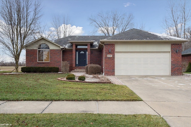 ranch-style home with a front yard and a garage