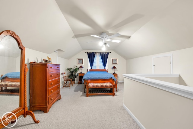 carpeted bedroom with vaulted ceiling and ceiling fan