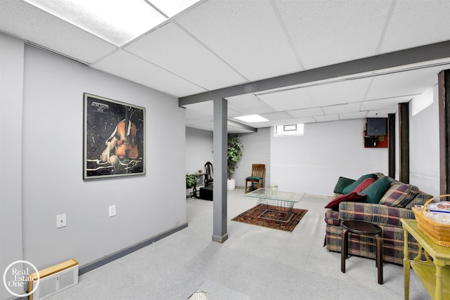 basement featuring a drop ceiling