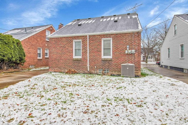 rear view of property featuring central AC unit