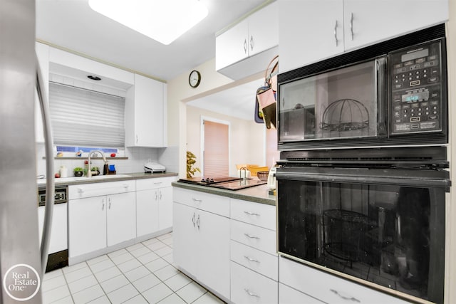 kitchen with dishwasher, white cabinetry, and black microwave