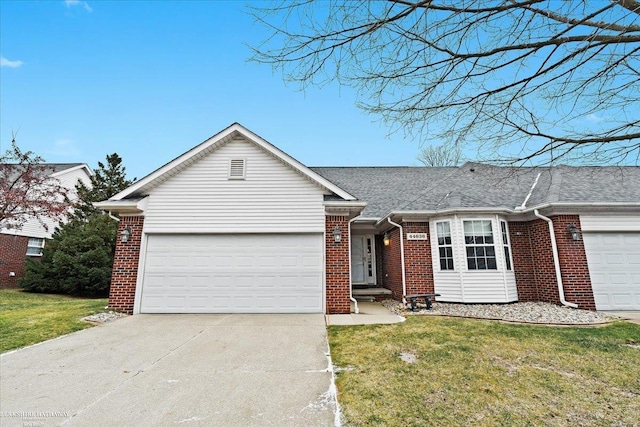 ranch-style house with a garage and a front lawn