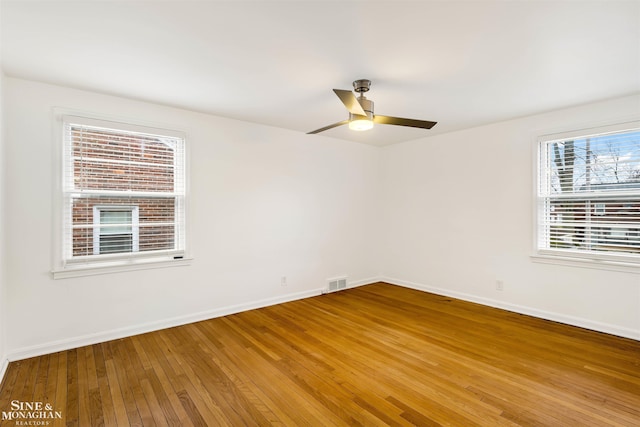 unfurnished room featuring ceiling fan and wood-type flooring