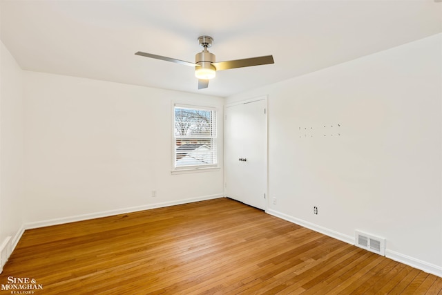 unfurnished room with ceiling fan and light hardwood / wood-style flooring