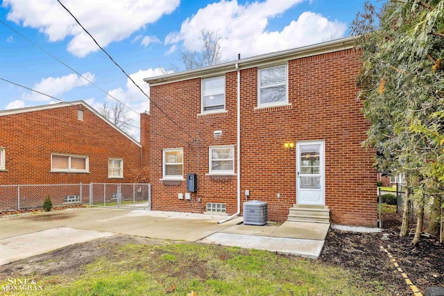 back of house with a patio area and central AC unit