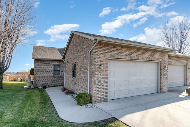 view of side of home with a garage and a yard