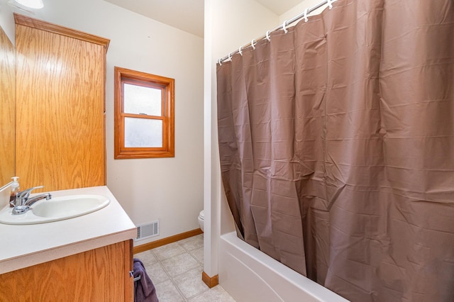 full bathroom with vanity, shower / bath combination with curtain, and toilet