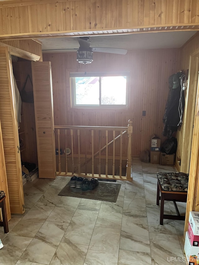 interior space featuring wood walls