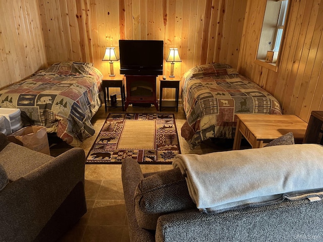 bedroom with wood walls