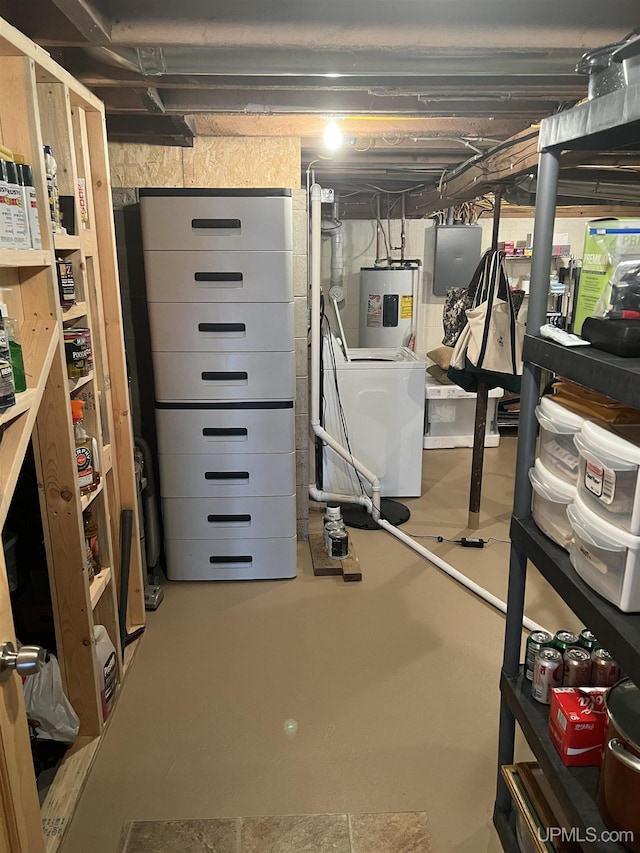 basement featuring electric panel and water heater