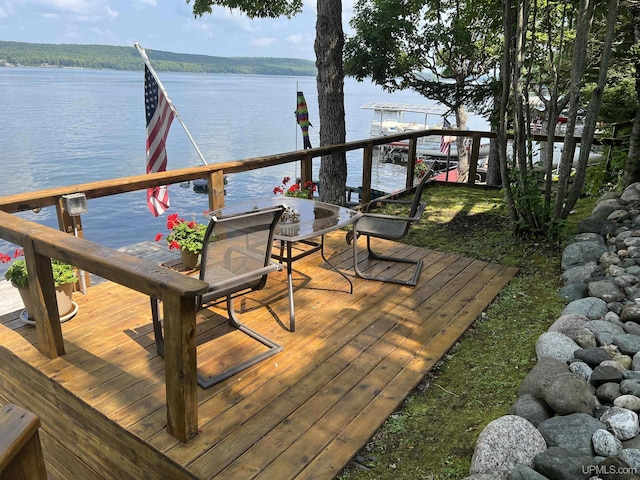 wooden deck featuring a water view