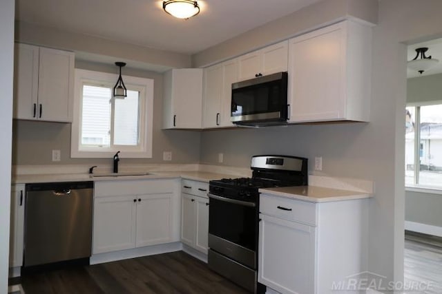 kitchen with white cabinetry, sink, and appliances with stainless steel finishes