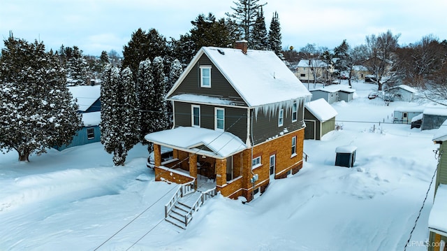 view of snow covered house