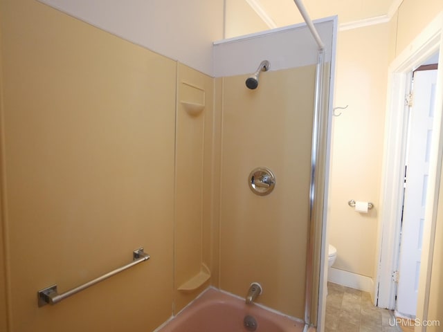 bathroom with shower / bathing tub combination, toilet, and ornamental molding