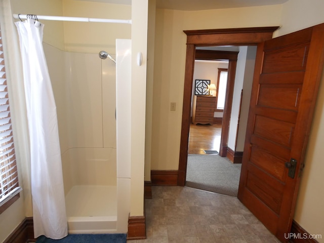 bathroom with a shower with curtain