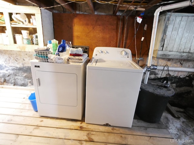 laundry room featuring washing machine and clothes dryer