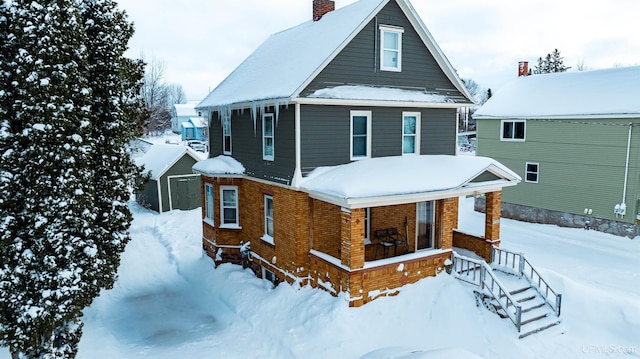 view of snow covered house