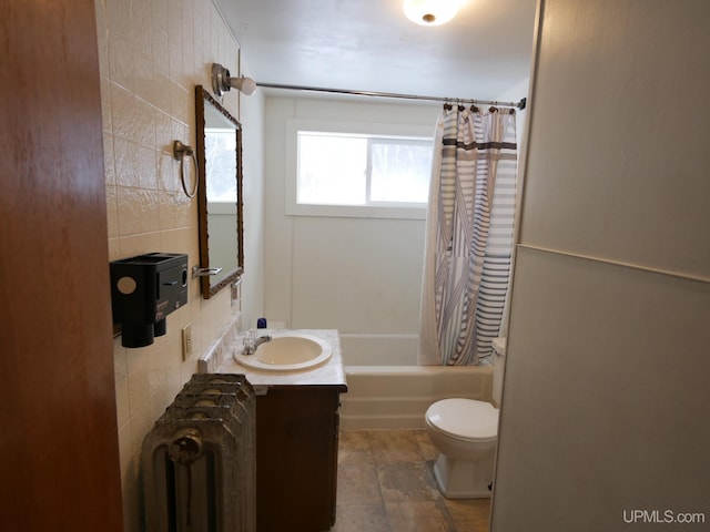 full bathroom with shower / bath combination with curtain, toilet, radiator heating unit, and vanity