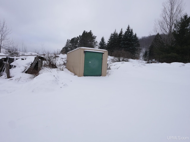 exterior space featuring an outbuilding and a garage