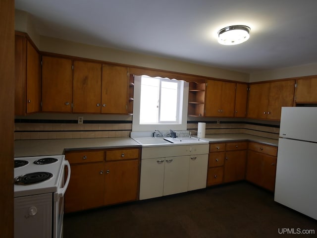 kitchen with white appliances and sink