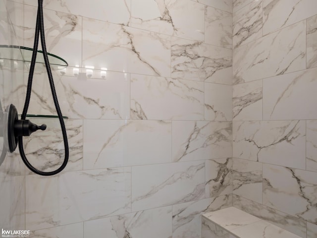 bathroom featuring tiled shower