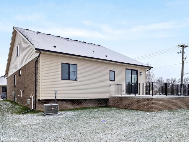 back of house featuring central AC