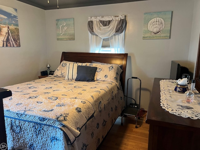 bedroom featuring hardwood / wood-style floors