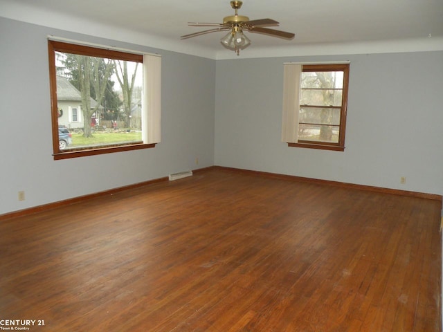 unfurnished room featuring ceiling fan and wood-type flooring