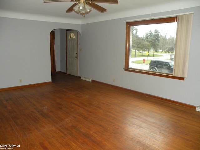 unfurnished room with ceiling fan and wood-type flooring