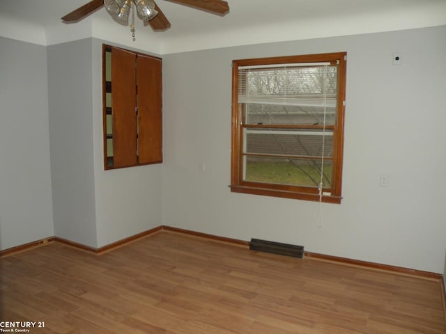 unfurnished room featuring ceiling fan and light hardwood / wood-style flooring