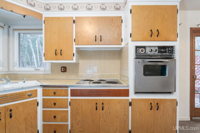 kitchen with backsplash, oven, and white electric stovetop