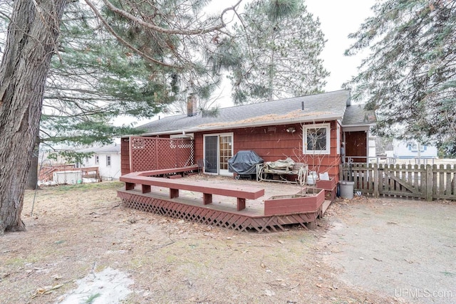 rear view of property with a deck